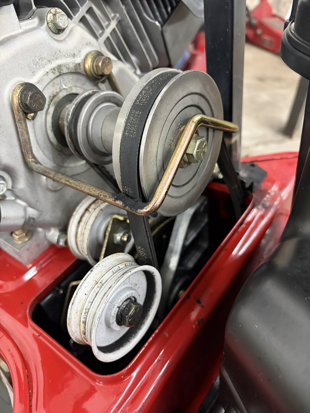 Snowblower belt and pulley components during service
